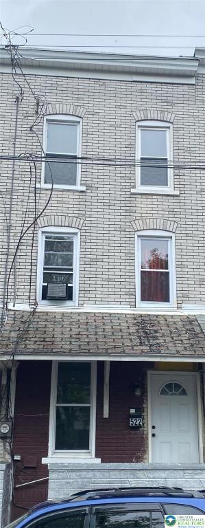 522 N Jordan St, Allentown City, PA 18102 - view of side of home featuring brick siding and cooling unit