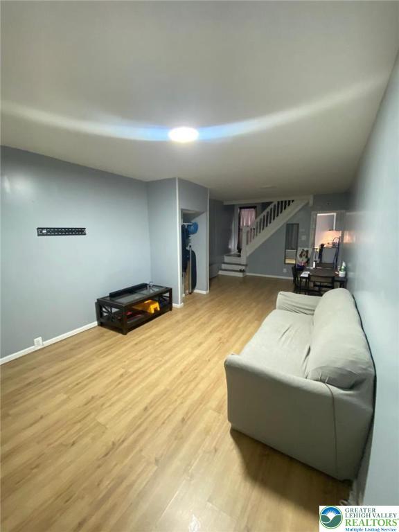 522 N Jordan St, Allentown City, PA 18102 - living room featuring stairway and wood finished floors