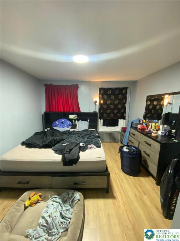 522 N Jordan St, Allentown City, PA 18102 - bedroom with light wood-style floors and radiator