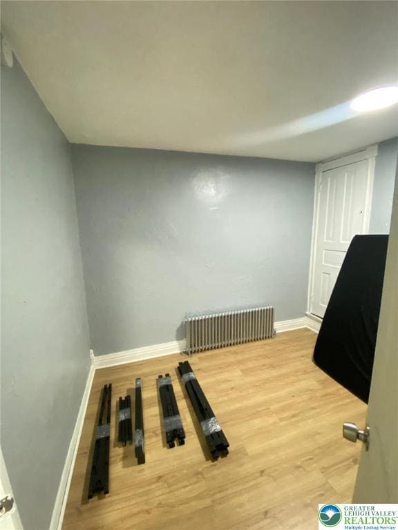 522 N Jordan St, Allentown City, PA 18102 - unfurnished bedroom featuring radiator and wood finished floors