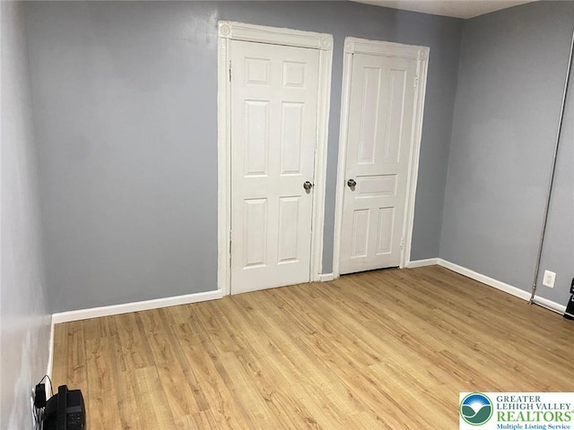 522 N Jordan St, Allentown City, PA 18102 - unfurnished bedroom with baseboards and wood finished floors