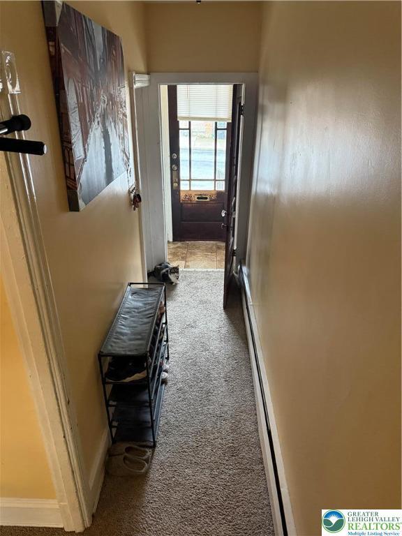 713 E 5th St, Bethlehem City, PA 18015 - hall with carpet and a baseboard heating unit