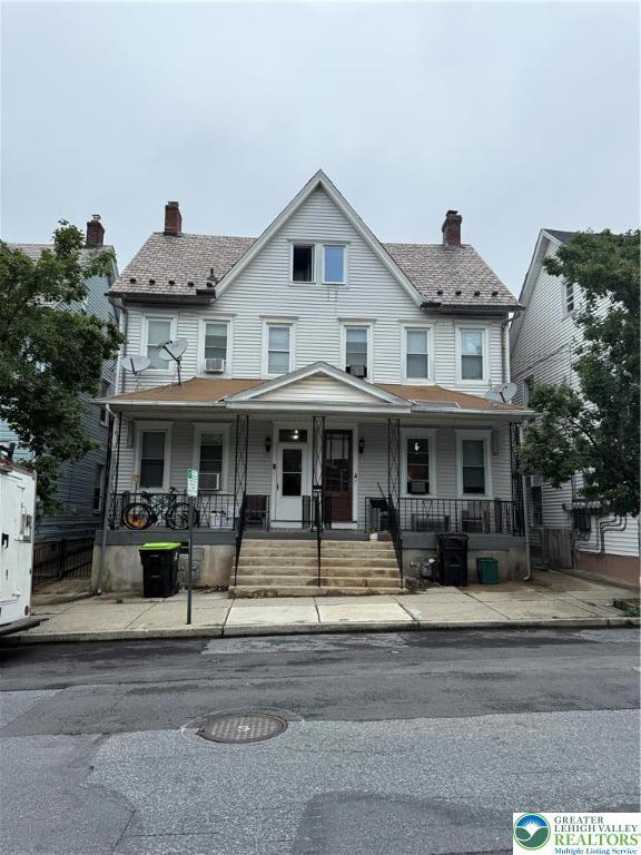 713 E 5th St, Bethlehem City, PA 18015 - view of property featuring a chimney and covered porch