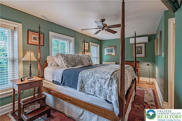 407 N 8th St, Allentown City, PA 18102 - bedroom with an AC wall unit, radiator, and a ceiling fan