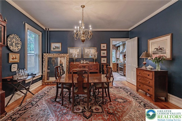 407 N 8th St, Allentown City, PA 18102 - dining space featuring wood finished floors, a chandelier, and ornamental molding