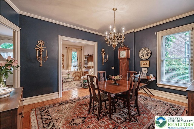 407 N 8th St, Allentown City, PA 18102 - dining space with hardwood / wood-style flooring, a chandelier, and crown molding