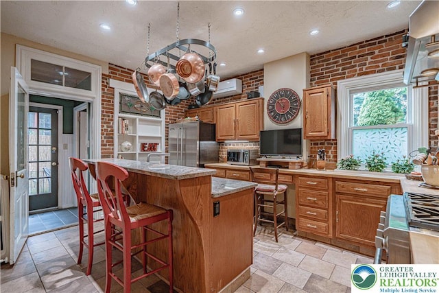407 N 8th St, Allentown City, PA 18102 - kitchen with high quality fridge, light countertops, a center island, recessed lighting, and decorative backsplash