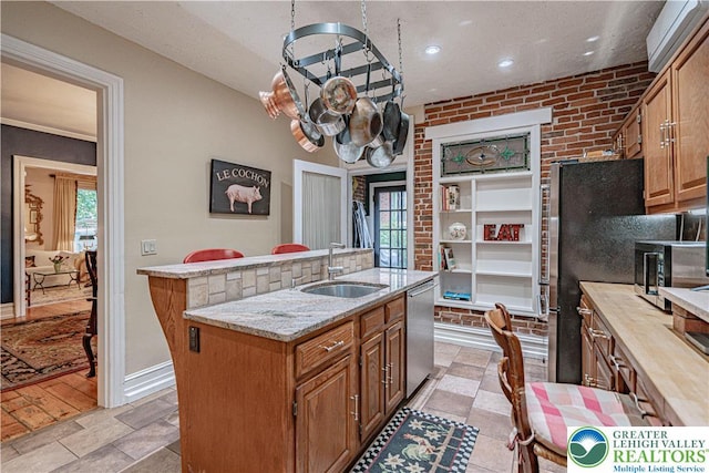 407 N 8th St, Allentown City, PA 18102 - kitchen featuring stainless steel appliances, a center island with sink, healthy amount of natural light, light stone counters, and recessed lighting