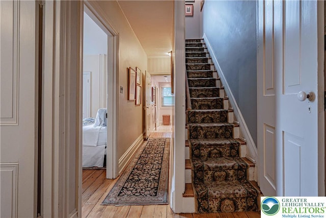 407 N 8th St, Allentown City, PA 18102 - stairway featuring wood-type flooring and baseboards