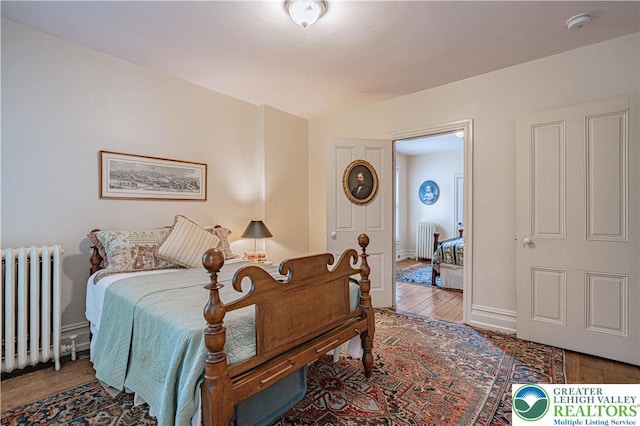407 N 8th St, Allentown City, PA 18102 - bedroom featuring radiator and wood finished floors