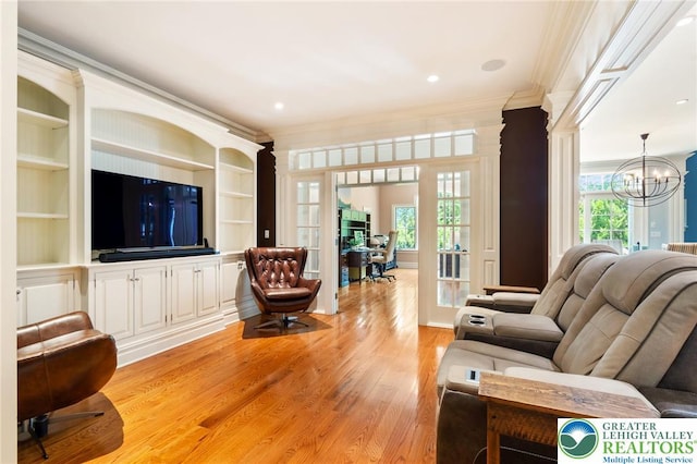2051 Forge Run, Bethlehem City, PA 18015 - living room featuring ornamental molding, a chandelier, light wood-type flooring, and built in shelves