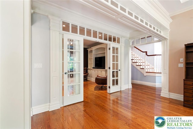 2051 Forge Run, Bethlehem City, PA 18015 - spare room with french doors, ornamental molding, wood finished floors, and stairs