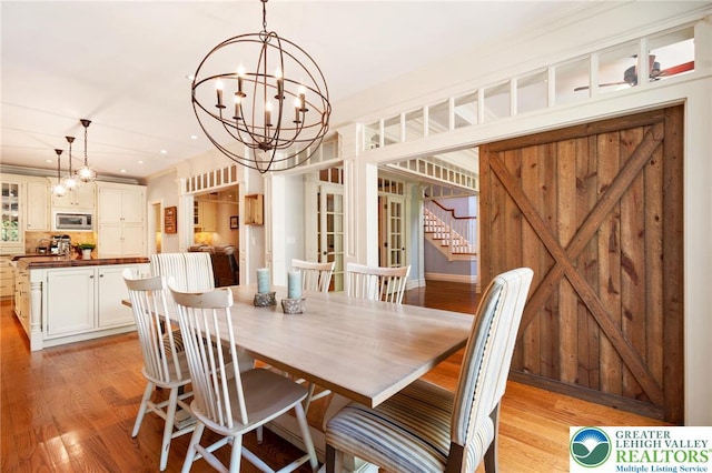 2051 Forge Run, Bethlehem City, PA 18015 - dining room featuring light wood-style floors, a chandelier, stairs, and recessed lighting