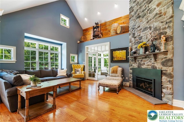 2051 Forge Run, Bethlehem City, PA 18015 - living room with high vaulted ceiling, wood finished floors, a fireplace, and healthy amount of natural light