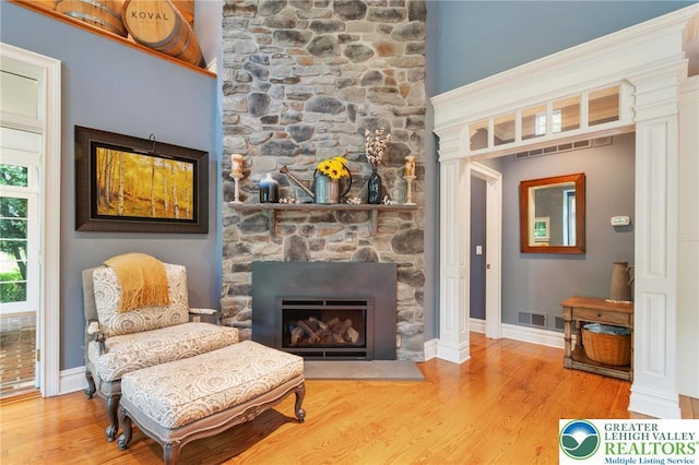 2051 Forge Run, Bethlehem City, PA 18015 - living area with a fireplace and wood finished floors
