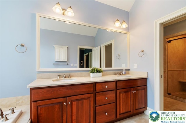 2051 Forge Run, Bethlehem City, PA 18015 - full bath with double vanity, a bath, tile patterned floors, and lofted ceiling