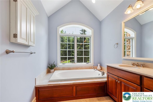 2051 Forge Run, Bethlehem City, PA 18015 - bathroom featuring plenty of natural light, vanity, a garden tub, and lofted ceiling