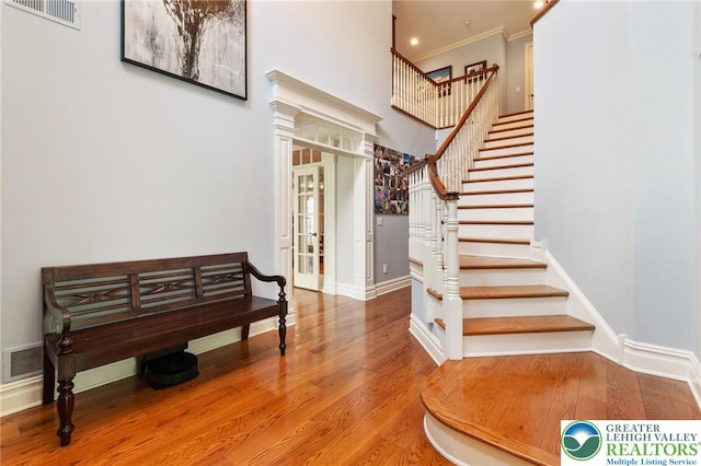 2051 Forge Run, Bethlehem City, PA 18015 - stairway with wood finished floors, french doors, ornamental molding, and a high ceiling
