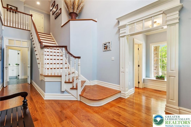 2051 Forge Run, Bethlehem City, PA 18015 - stairs with wood finished floors, a high ceiling, and ornamental molding