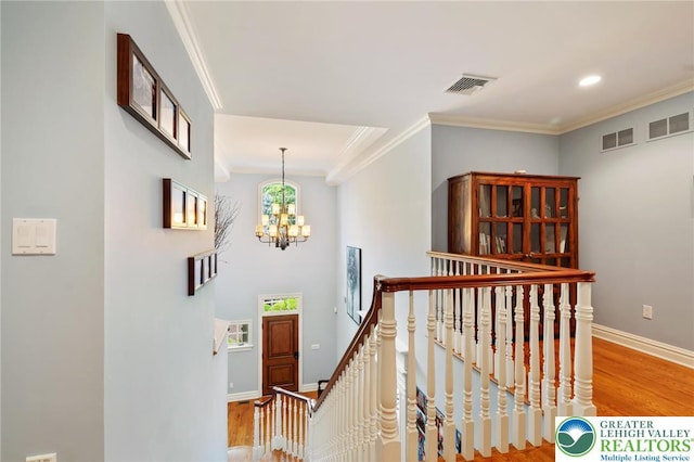 2051 Forge Run, Bethlehem City, PA 18015 - hallway with wood finished floors, an upstairs landing, crown molding, a chandelier, and recessed lighting