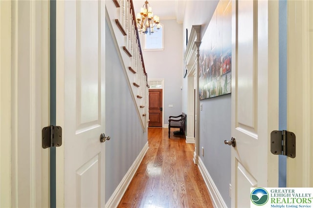 2051 Forge Run, Bethlehem City, PA 18015 - corridor featuring light wood-style floors, a chandelier, stairs, and crown molding