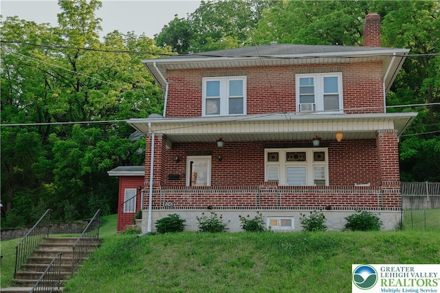 5242 3rd St, Whitehall Twp, PA 18052 - view of front of house featuring a porch, a chimney, brick siding, and cooling unit