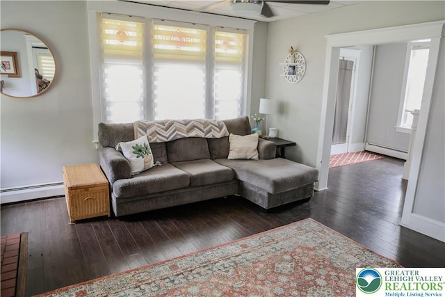 5242 3rd St, Whitehall Twp, PA 18052 - living room featuring baseboard heating, wood-type flooring, and a ceiling fan