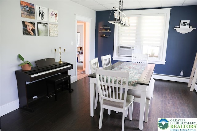 5242 3rd St, Whitehall Twp, PA 18052 - dining area with a paneled ceiling, a baseboard heating unit, wood finished floors, and cooling unit