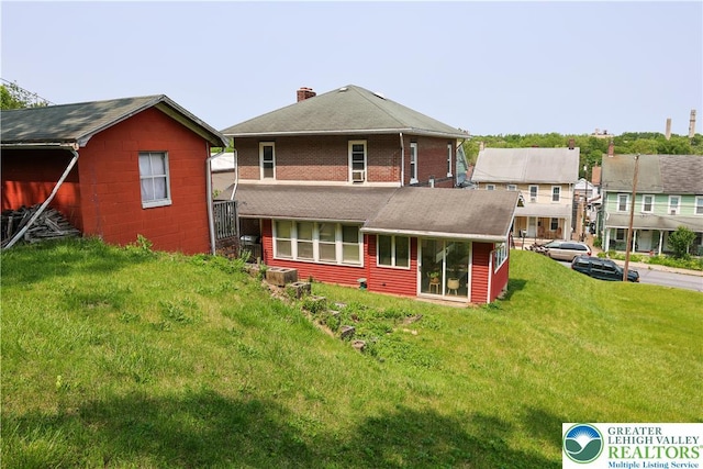 5242 3rd St, Whitehall Twp, PA 18052 - rear view of house featuring a chimney and a yard