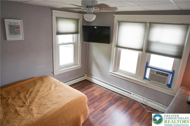 5242 3rd St, Whitehall Twp, PA 18052 - bedroom featuring a paneled ceiling, multiple windows, cooling unit, dark wood finished floors, and baseboard heating