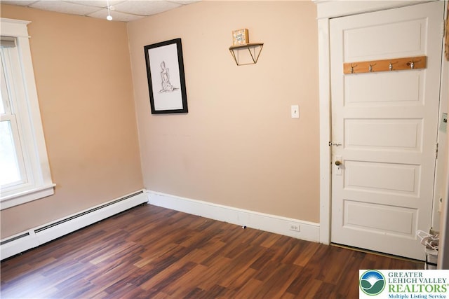 5242 3rd St, Whitehall Twp, PA 18052 - unfurnished room featuring a baseboard radiator and dark wood-type flooring