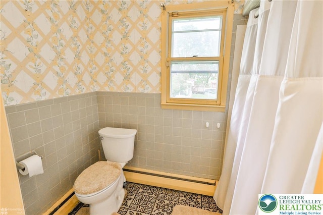 3609 Erie St, Palmer Twp, PA 18045 - bathroom with wallpapered walls, a wainscoted wall, tile walls, a baseboard radiator, and baseboard heating
