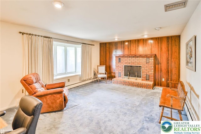 3609 Erie St, Palmer Twp, PA 18045 - living area featuring a baseboard radiator, wood walls, carpet, and a fireplace