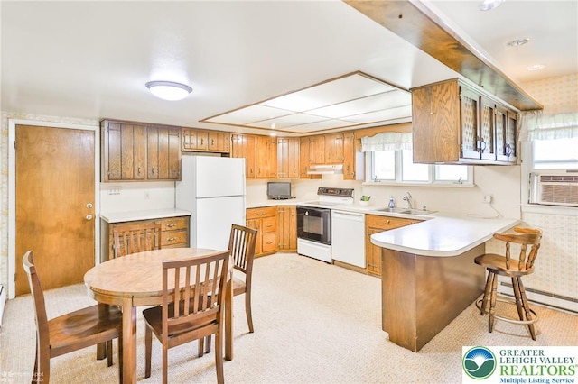 3609 Erie St, Palmer Twp, PA 18045 - kitchen featuring white appliances, under cabinet range hood, light carpet, a peninsula, and light countertops