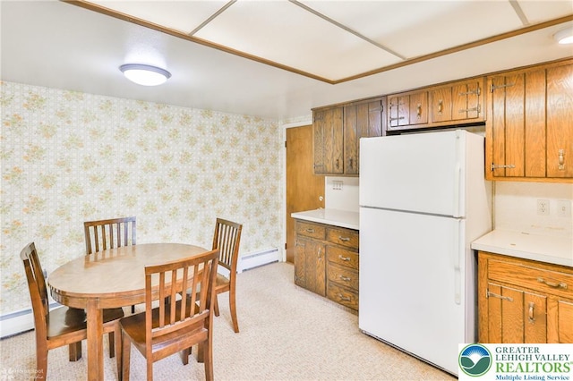 3609 Erie St, Palmer Twp, PA 18045 - kitchen with freestanding refrigerator, a baseboard heating unit, wallpapered walls, brown cabinetry, and light countertops