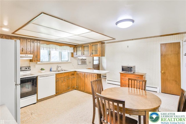 3609 Erie St, Palmer Twp, PA 18045 - kitchen with white appliances, under cabinet range hood, baseboard heating, brown cabinets, and wallpapered walls