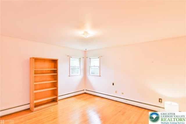 3609 Erie St, Palmer Twp, PA 18045 - empty room with baseboard heating, a baseboard heating unit, and wood finished floors