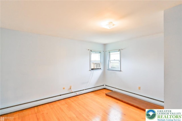 3609 Erie St, Palmer Twp, PA 18045 - empty room featuring a baseboard heating unit and wood finished floors