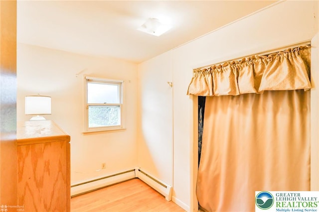 3609 Erie St, Palmer Twp, PA 18045 - unfurnished bedroom featuring wood finished floors and a baseboard radiator