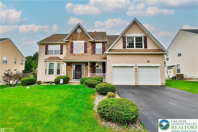 10 Windrift Ct, Easton, PA 18045 - view of front of property with driveway, a garage, a front lawn, and a porch