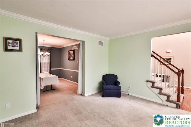 10 Windrift Ct, Easton, PA 18045 - living area with carpet, crown molding, stairway, and a chandelier