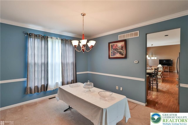 10 Windrift Ct, Easton, PA 18045 - dining room featuring a chandelier, plenty of natural light, and crown molding
