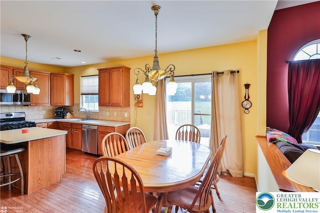 10 Windrift Ct, Easton, PA 18045 - dining area with light wood-type flooring, plenty of natural light, a chandelier, and recessed lighting
