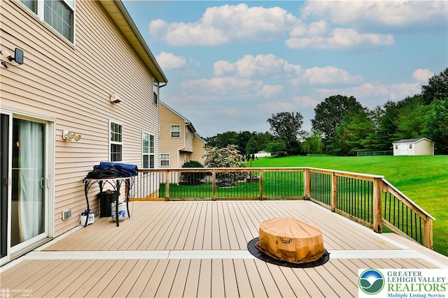 10 Windrift Ct, Easton, PA 18045 - deck with a yard, an outdoor structure, and view of wooded area