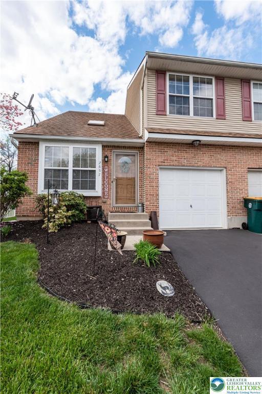 2657 Anthony Ct, Palmer Twp, PA 18045 - view of front of property with a garage, asphalt driveway, and brick siding