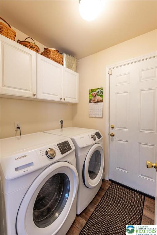2657 Anthony Ct, Palmer Twp, PA 18045 - laundry area with cabinet space, washer and dryer, and dark wood-style flooring