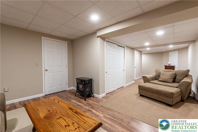2657 Anthony Ct, Palmer Twp, PA 18045 - living room featuring a paneled ceiling, wood finished floors, a wood stove, and recessed lighting