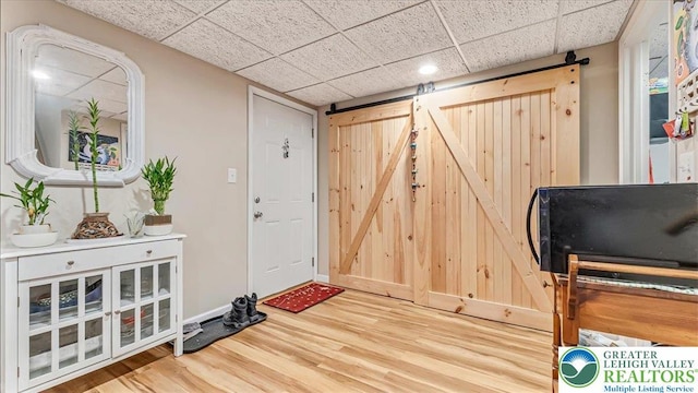 3954 Cedar Dr, Lehigh Twp, PA 18088 - entryway with a barn door, wood finished floors, a paneled ceiling, and recessed lighting
