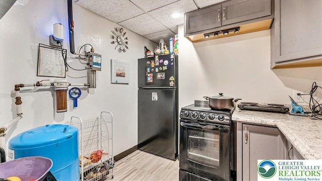 3954 Cedar Dr, Lehigh Twp, PA 18088 - kitchen featuring black appliances, a paneled ceiling, recessed lighting, and range hood