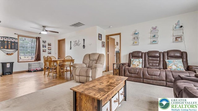 3954 Cedar Dr, Lehigh Twp, PA 18088 - living area featuring a ceiling fan, light carpet, and light wood-type flooring